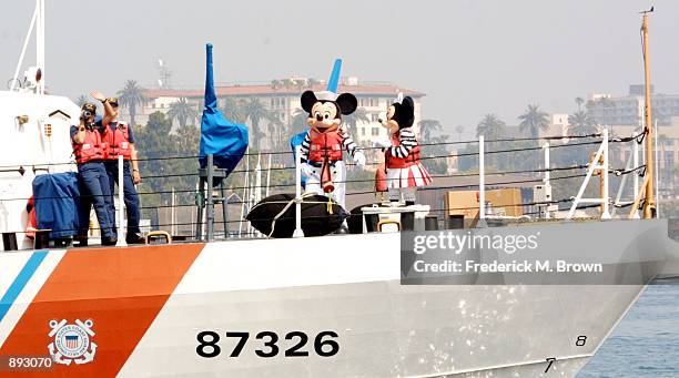 Mickey Mouse and Minnie Mouse attend The Walt Disney Company's donation of one million books to First Book, a non profit organization dedicated to...