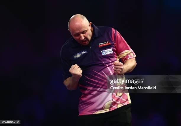 James Wilson of England celebrates victory in his first round match against Krzysztof Ratajski of Poland during day one of the 2018 William Hill PDC...