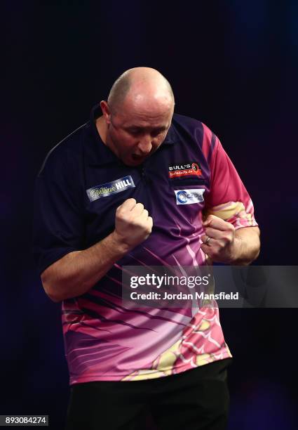 James Wilson of England celebrates victory in his first round match against Krzysztof Ratajski of Poland during day one of the 2018 William Hill PDC...