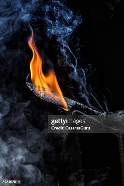 burning knife blade in forge - forge stock pictures, royalty-free photos & images