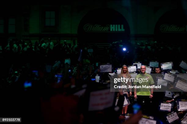 Michael van Gerwen of the Netherlands walks in prior to his first round match against Christian Kist of the Netherlands during day one of the 2018...