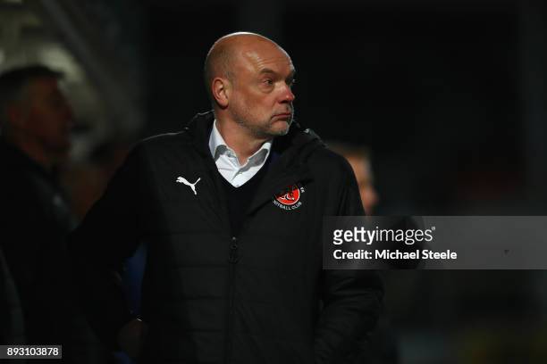 Uwe Rosler the manager of Fleetwood Town looks on during the Emirates FA Cup second round replay match between Hereford FC and Fleetwood Town at...