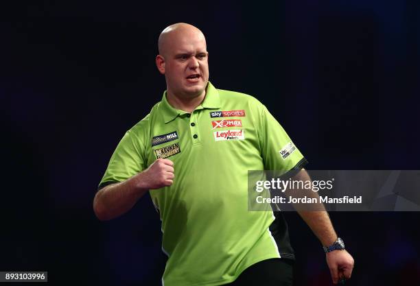 Michael van Gerwen of the Netherlands celebrates a set during his first round match against Christian Kist of the Netherlands during day one of the...