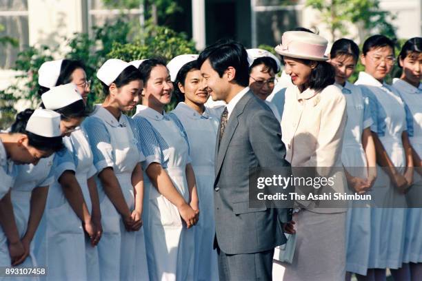 Crown Prince Naruhito and Crown Princess Masako talk to nurses during their visit to the Iwate Prefecture Red Cross Blood Center on July 13, 1993 in...