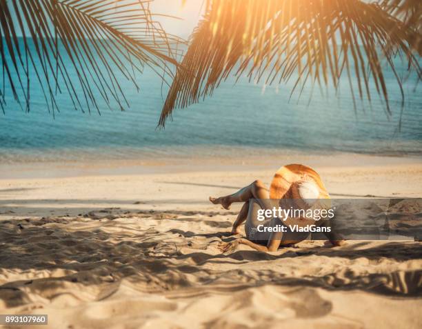 woman at tropical beach - white sailor hat stock pictures, royalty-free photos & images