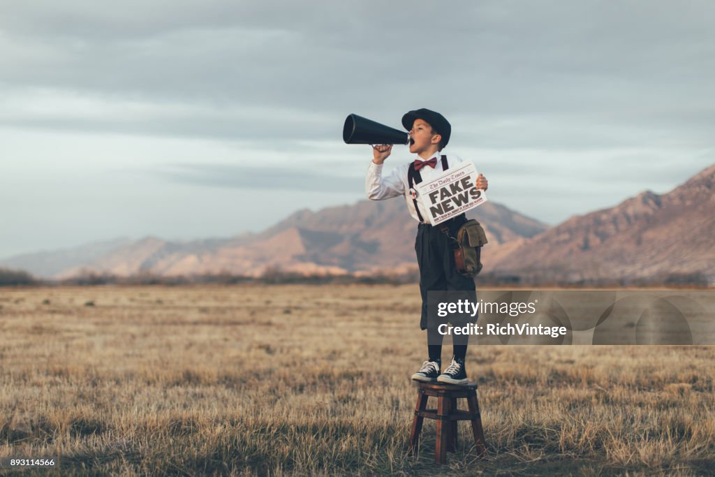 Old Fashioned News Boy Holding Fake Newspaper