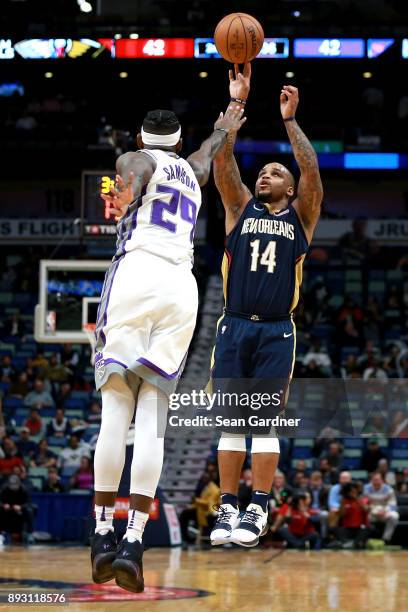 Jameer Nelson of the New Orleans Pelicans shoots over Buddy Hield of the Sacramento Kings during the first half of a NBA game at the Smoothie King...