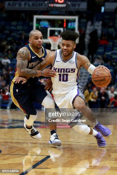Frank Mason III of the Sacramento Kings drives past Jameer Nelson of the New Orleans Pelicans during the second half of a NBA game at the Smoothie...