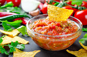 Traditional mexican homemade salsa sauce with ingredients, tomat