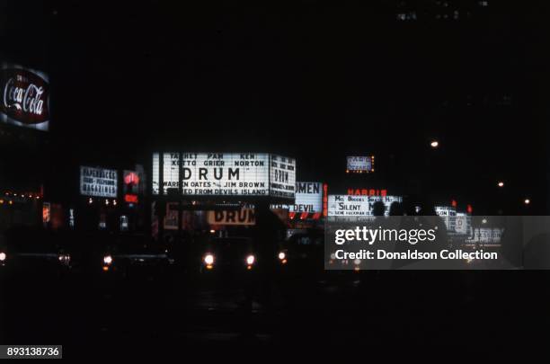 View of the marquees of cinemas on West 42nd Street including the New Amsterdam Theatre, Cine 42, the Harris Theater and the Liberty Theatre in 1976...
