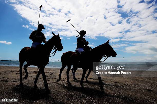 Polo players ride into the playing field during 2018 Takapuna Beach Polo on December 15, 2017 in Auckland, New Zealand.