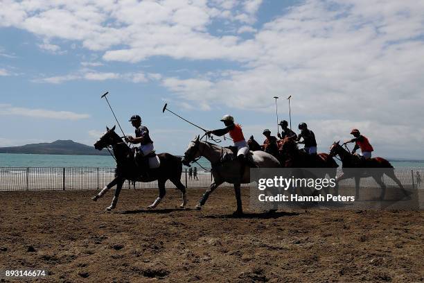 Polo players compete during 2018 Takapuna Beach Polo event on December 15, 2017 in Auckland, New Zealand.