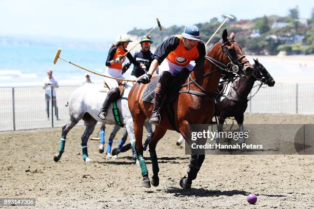 Matt Hitchman attacks during the 2018 Takapuna Beach Polo on December 15, 2017 in Auckland, New Zealand.