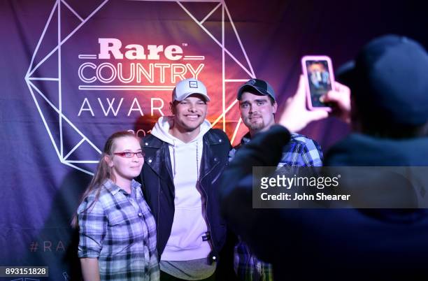 Singer-songwriter Kane Brown takes photos with fans at the Rare Country Awards on December 14, 2017 in Nashville, Tennessee.