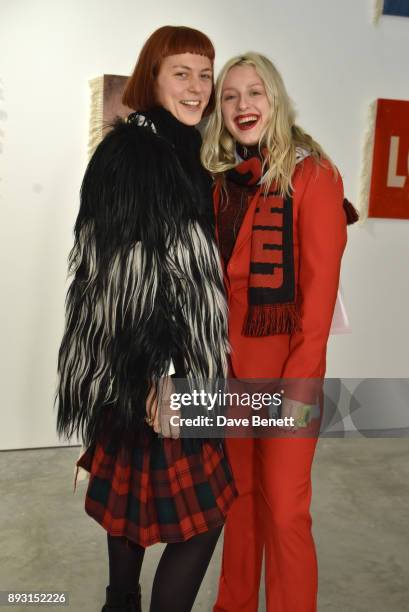 Rose Easton and Harriet Varney attend a private view of artist Joe Sweeney's new exhibition "Loose Change" at The Cob Gallery on December 14, 2017 in...