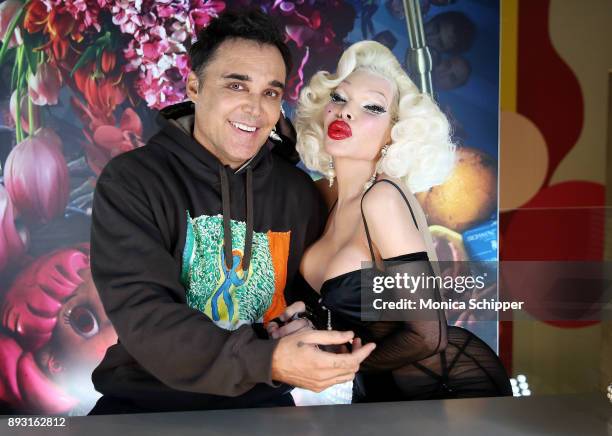 Amanda Lepore poses for a photo with photographer David LaChapelle when he signs copies of his new double-volume book "Good News Part I" And "Lost +...