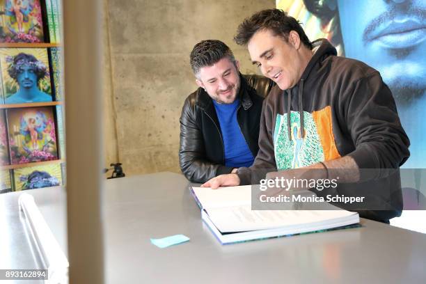 Photographer David LaChapelle signs copies of his new double-volume book "Good News Part I" And "Lost + Found Part II" at TASCHEN on December 14,...