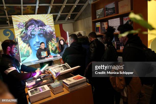 Guests wait in line as photographer David LaChapelle signs copies of his new double-volume book "Good News Part I" And "Lost + Found Part II" at...