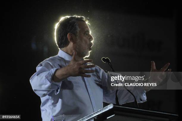 The Chilean presidential candidate for the ruling New Majority coalition, Alejandro Guillier, gives a speech during his final election campaign rally...