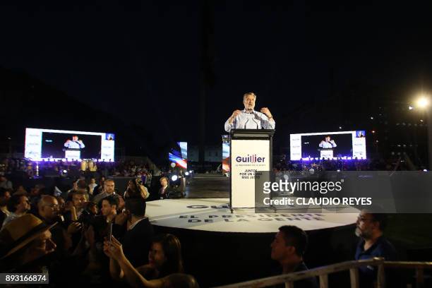 The Chilean presidential candidate for the ruling New Majority coalition, Alejandro Guillier, gives a speech during his final election campaign rally...