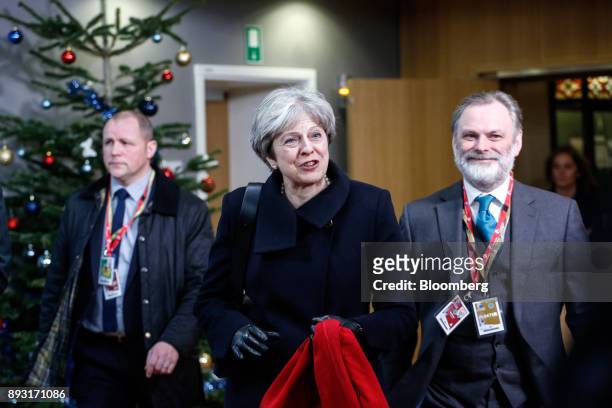 Theresa May, U.K. Prime minister, center, and Tim Barrow, U.K. Permanent representative to the European Union , right, leave after attending a...