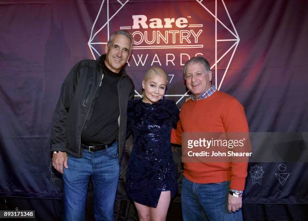 Jeff Garrison Country Format Leader for CMG Radio, singer-songwriter Raelynn and Leon Levitt Publisher and Vice President of Rare Country take photos...