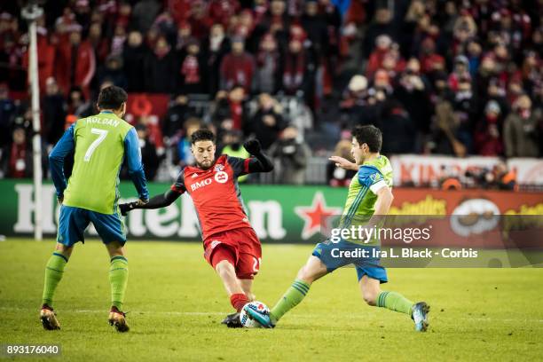 Jonathan Osorio of Toronto FC tries to take control of the ball against Nicolas Lodeiro of Seattle Sounders during the 2017 Audi MLS Championship Cup...