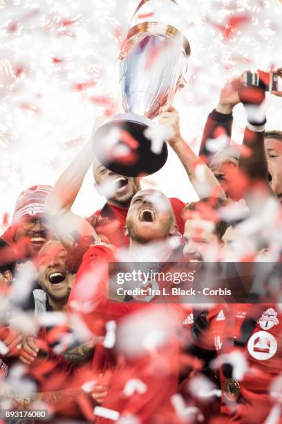 Captain Michael Bradley of Toronto FC screams as he hoists the MLS Championship Cup and celebrates with teammates after the 2017 Audi MLS...