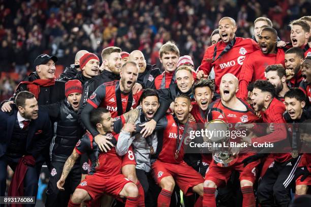 Captain Michael Bradley of Toronto FC screams as he hoists the MLS Championship Cup and celebrates with teammates after the 2017 Audi MLS...