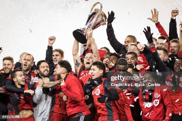 Captain Michael Bradley of Toronto FC screams as he hoists the MLS Championship Cup and celebrates with teammates after the 2017 Audi MLS...