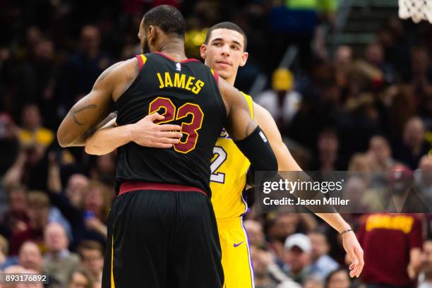 LeBron James of the Cleveland Cavaliers and Lonzo Ball of the Los Angeles Lakers embrace during the first half at Quicken Loans Arena on December 14,...