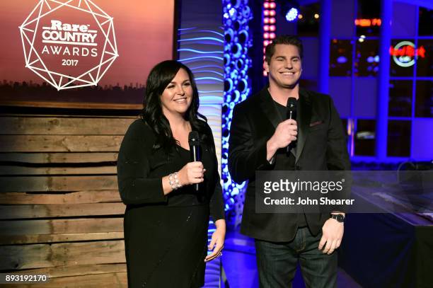 Hosts Christi Brooks and J.R. Jaus speak onstage during the Rare Country Awards on December 14, 2017 in Nashville, Tennessee.
