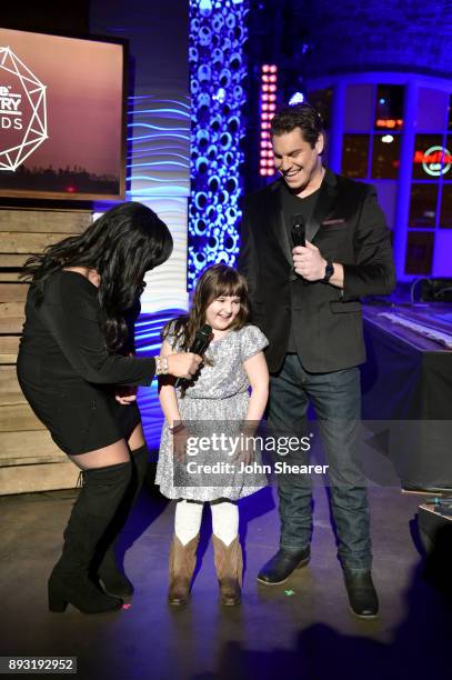 Host Christi Brooks, guest Daisy Prescott and host J.R. Jaus speak onstage during the Rare Country Awards on December 14, 2017 in Nashville,...