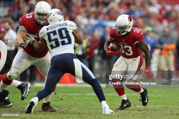 Running back Kerwynn Williams of the Arizona Cardinals rushes the football against the Tennessee Titans during the NFL game at the University of...