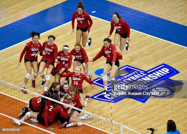 Nebraska celebrates a 3-2 win against Penn State in the the semifinals of the NCAA Division I Final Four on Thursday, Dec. 14 at the Sprint Center in...