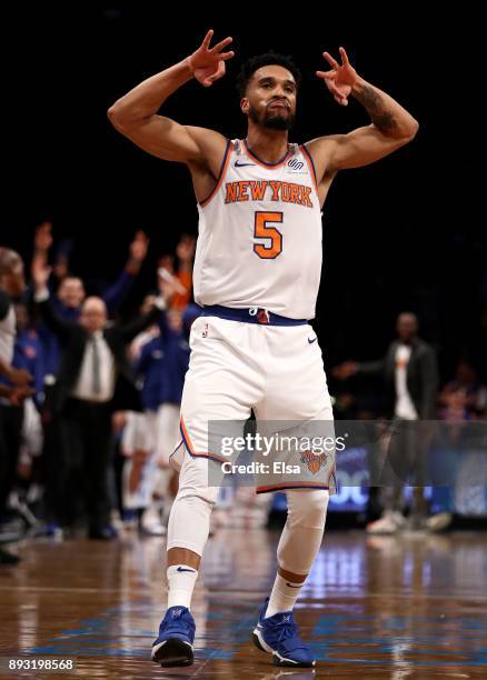 Courtney Lee of the New York Knicks celebrates his three point shot in the second half against the Brooklyn Nets at the Barclays Center on December...