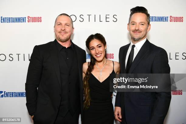 Christian Bale, Q'Orianka Kilcher and Scott Cooper attend the premiere of Entertainment Studios Motion Pictures' "Hostiles" at Samuel Goldwyn Theater...