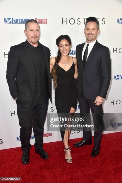 Christian Bale, Q'Orianka Kilcher and Scott Cooper attend the premiere of Entertainment Studios Motion Pictures' "Hostiles" at Samuel Goldwyn Theater...
