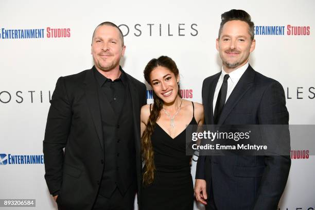 Christian Bale, Q'Orianka Kilcher and Scott Cooper attend the premiere of Entertainment Studios Motion Pictures' "Hostiles" at Samuel Goldwyn Theater...