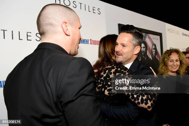 Christian Bale, Sibi Blazic and Scott Cooper attend the premiere of Entertainment Studios Motion Pictures' "Hostiles" at Samuel Goldwyn Theater on...