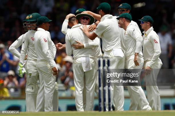 Nathan Lyon and Peter Handscomb of Australia celebrate the wicket of Dawid Malan of England during day two of the Third Test match during the 2017/18...