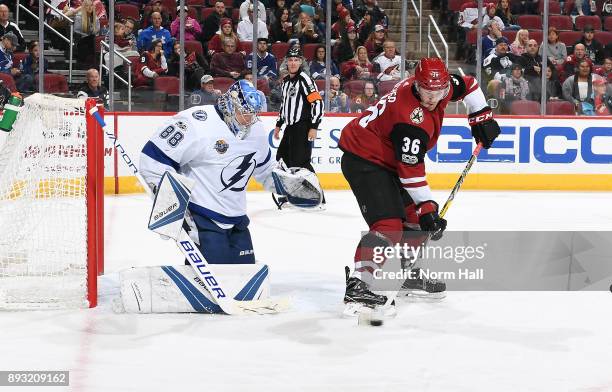 Christian Fischer of the Arizona Coyotes looks to get a shot on goalie Andrei Vasilevskiy of the Tampa Bay Lightning during the second period at Gila...
