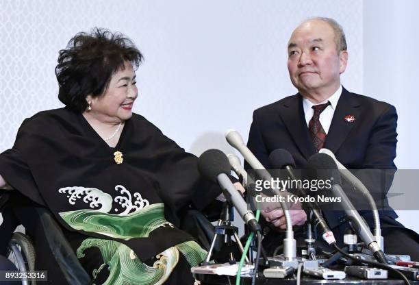 Atomic bomb survivors Setsuko Thurlow and Toshiki Fujimori shake hands during a press conference after the Nobel Peace Prize award ceremony in Oslo...