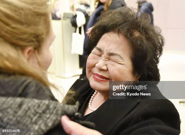 Setsuko Thurlow, a survivor of the 1945 U.S. Atomic bombing in Hiroshima, is overcome with emotion after attending the Nobel Peace Prize award...