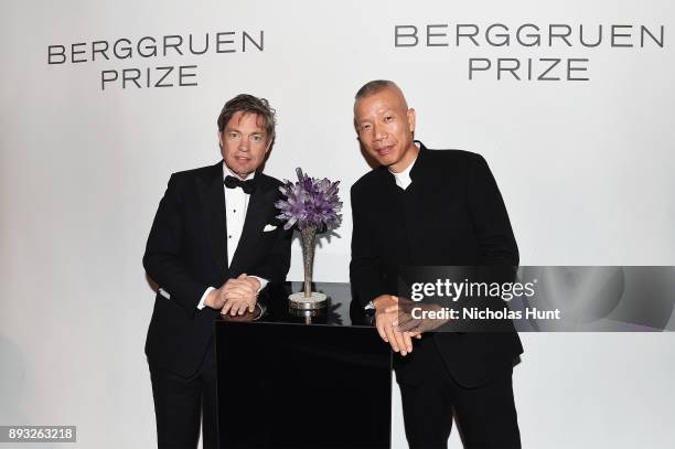 Chairman of the Berggruen Institute Nicolas Berggruen and artist Cai Guo-Qiang pose with Berggruen Prize 2017 trophy the the Berggruen Prize Gala at...