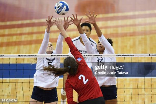 Haleigh Washington and Ali Frantti of Penn State University jump for a block against the University of Nebraska during the Division I Women's...