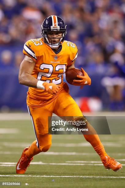 Devontae Booker of the Denver Broncos runs with the ball against the Indianapolis Colts during the second half at Lucas Oil Stadium on December 14,...