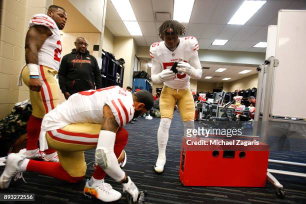 Reuben Foster and Louis Murphy of the San Francisco 49ers relax in the locker room prior to the game against the Houston Texans at NRG Stadium on...