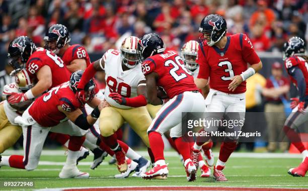 Earl Mitchell of the San Francisco 49ers closes in on Lamar Miller of the Houston Texans during the game at NRG Stadium on December 10, 2017 in...
