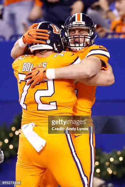 Jeff Heuerman of the Denver Broncos celebrates with Garett Bolles after a touchdown against the Indianapolis Colts during the second half at Lucas...